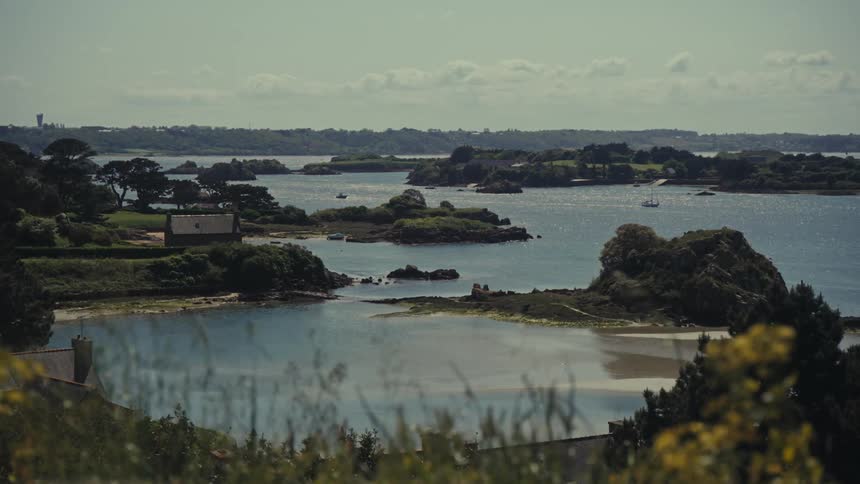 View of the French shoreline with a house and small islands