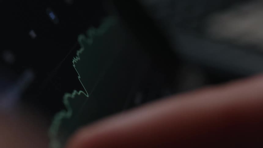 A person is pressing a graph on their tablet