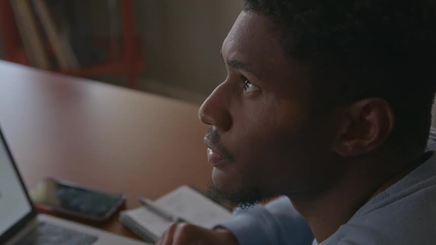 A man is working in his office