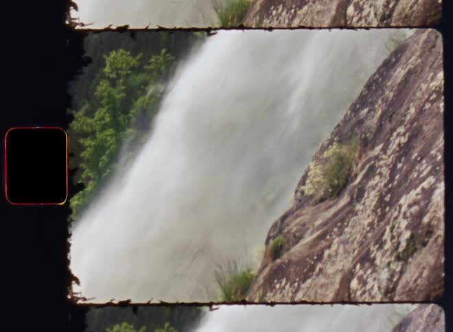 The waterfall rushes off the cliff