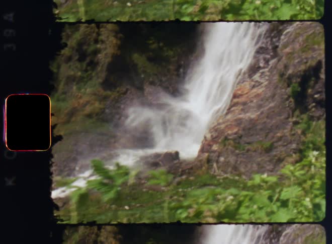The waterfall is pouring over the cliff