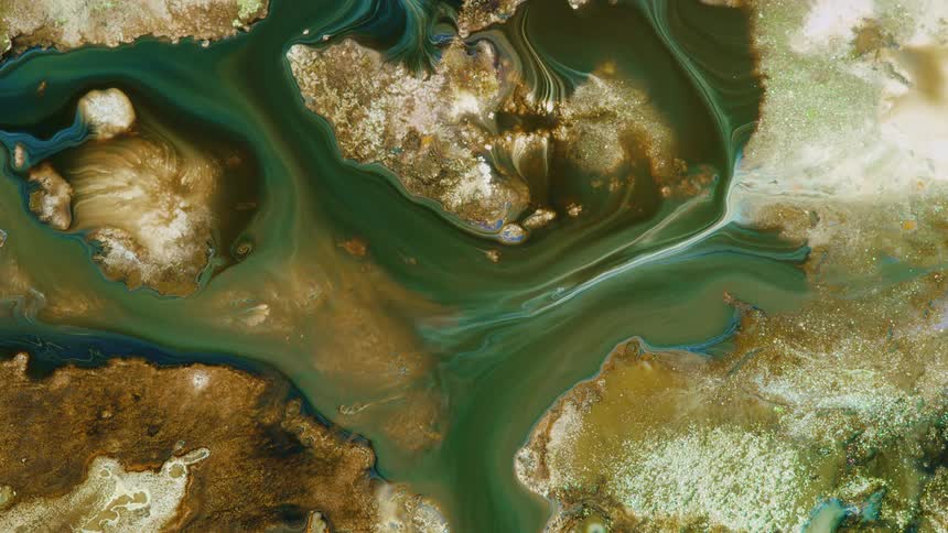 a miniature image of planet earth with streams of green dark rivers on brown background