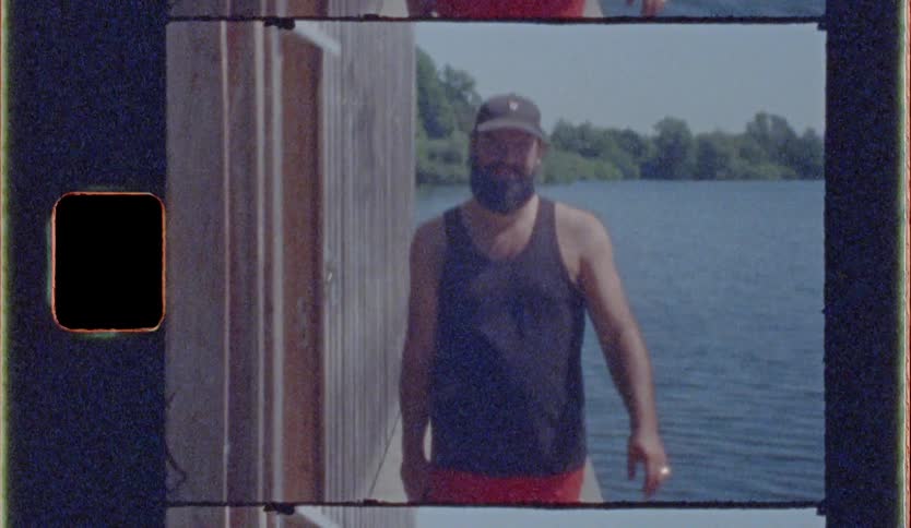 Man walking smiling in a landscape with water