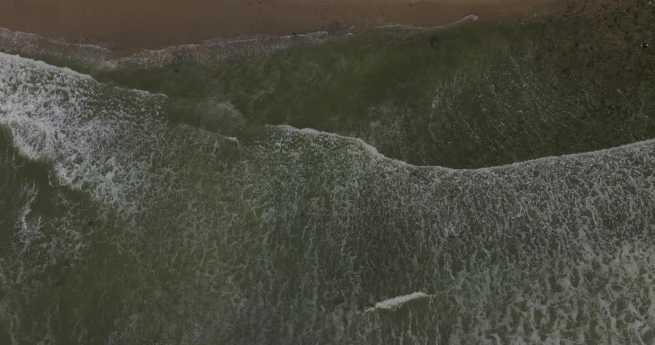 Waves crash against the shore