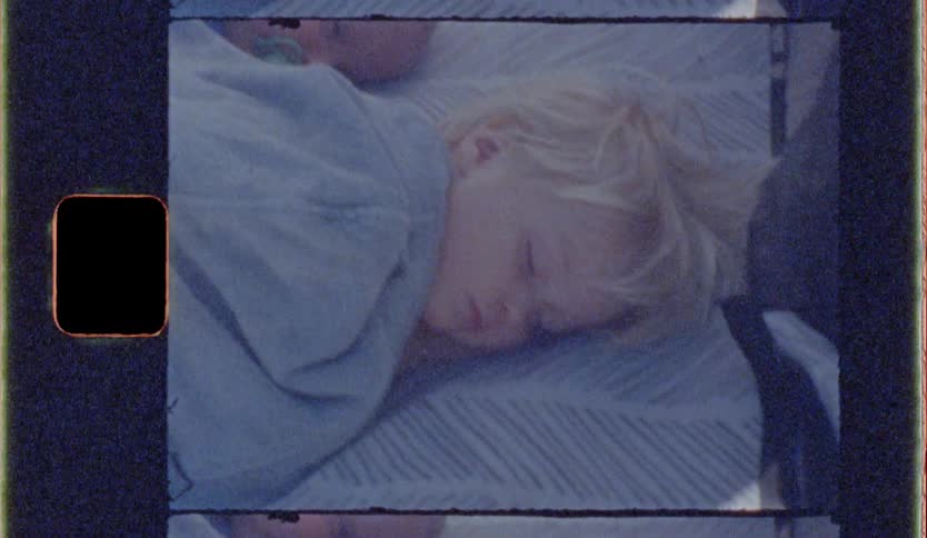 Two children sleep together