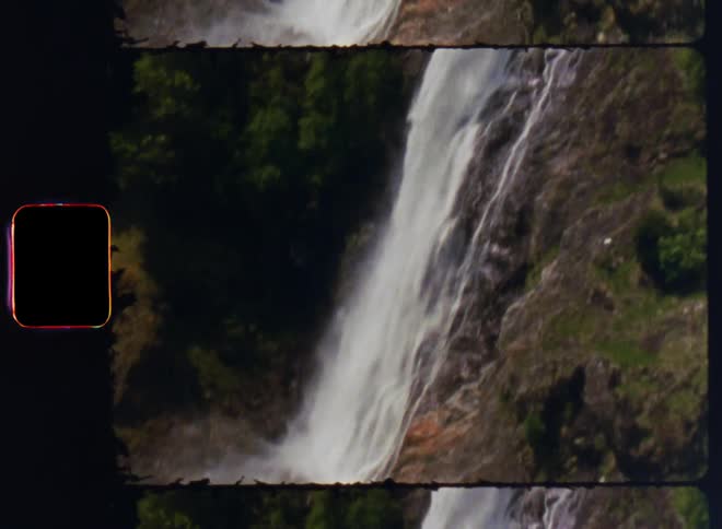 A forst with a mountain and a waterfall from the mountain during the day