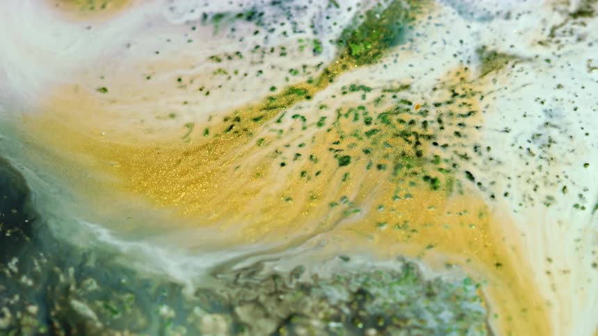 a green and golden land with streams of white liquid spreading and mixing