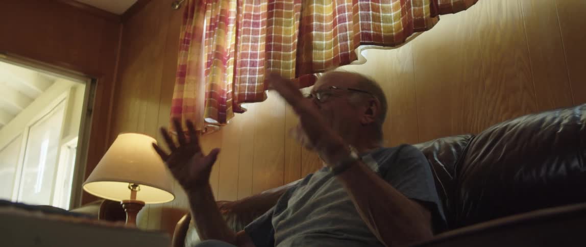 A man cheers at home