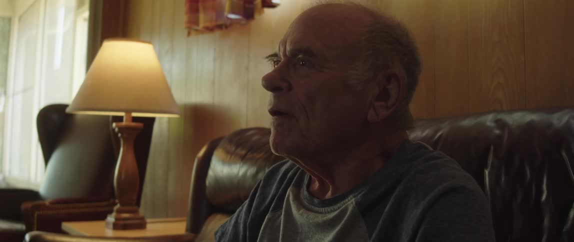 A man gets angry while watching something