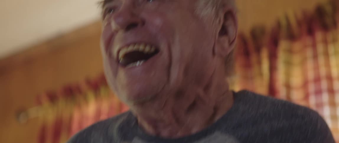 A man is cheering at home