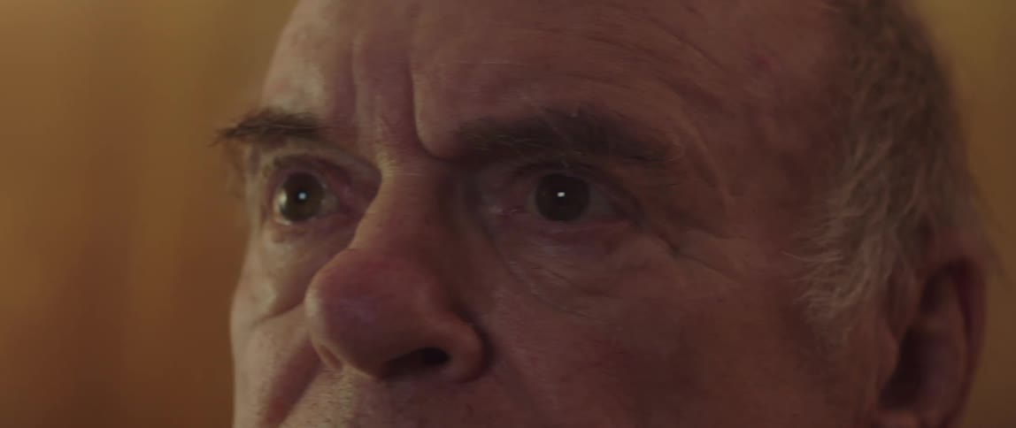 A man is looking forward at something