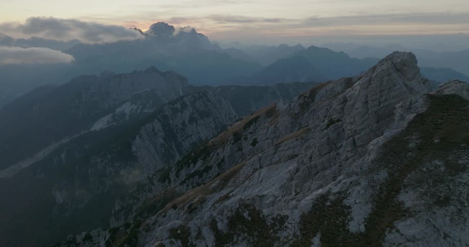 A vast mountain range under the evening sky