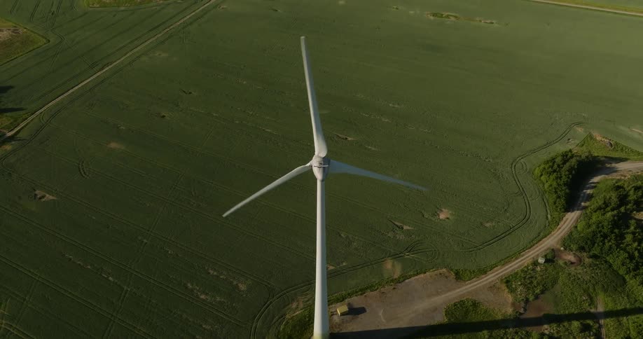 A large windmill is spinning