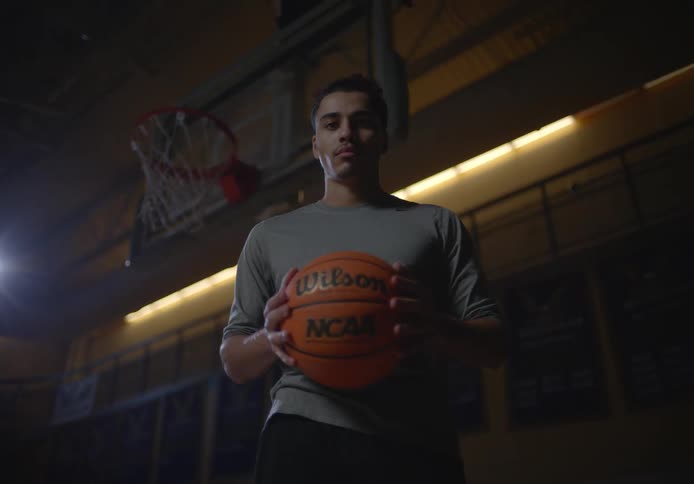 A man is holding a basketball