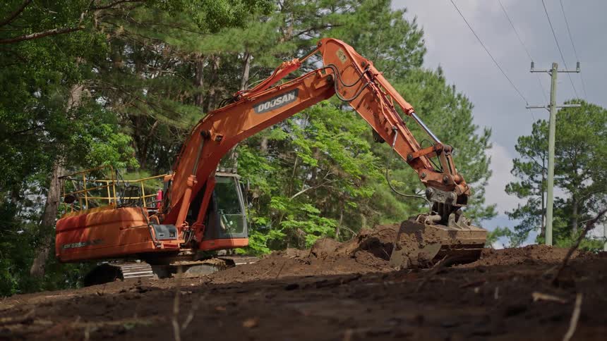 The excavator is digging up dirt