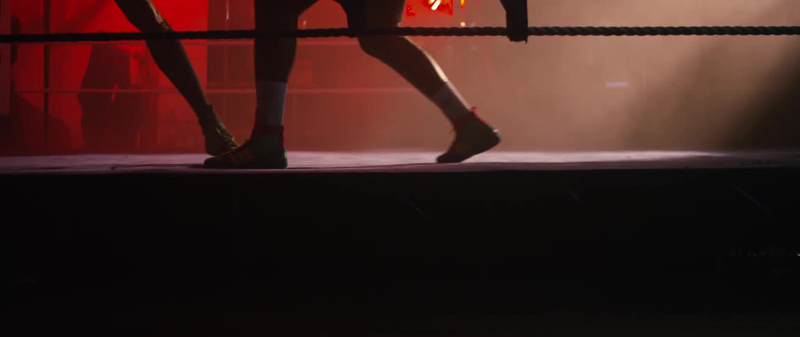 Two people are boxing in the ring