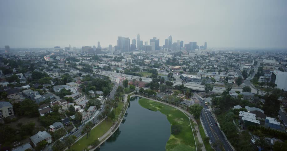 A highway separates suburban homes from downtown