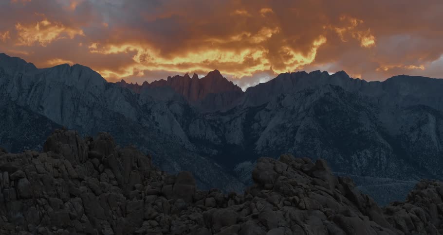 A jagged mountain ridge under a cloudy sky