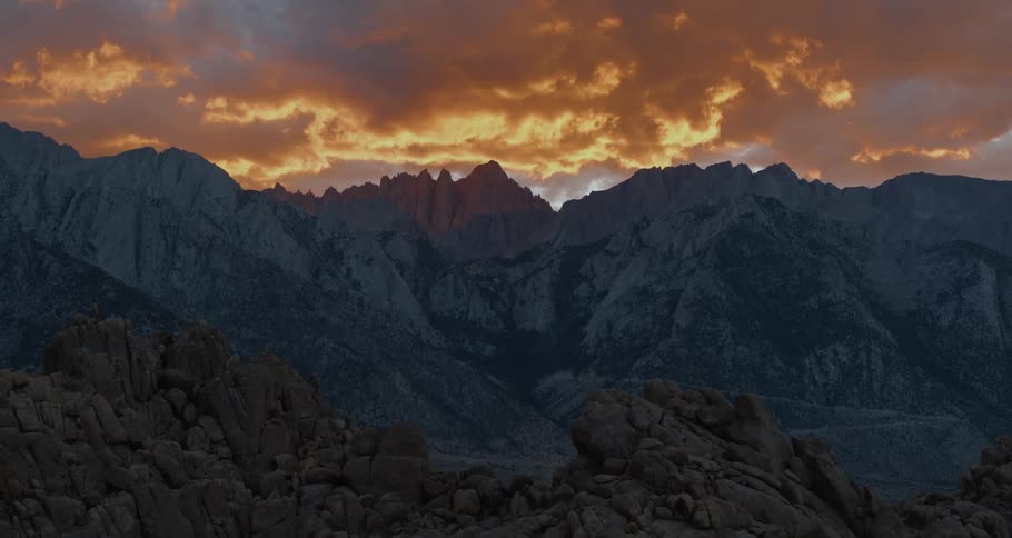 The camera pulls away during an intense sunset shot of iconic Mount Whitney in the Eastern Sierras