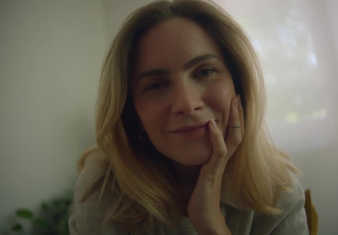 A woman is smiling