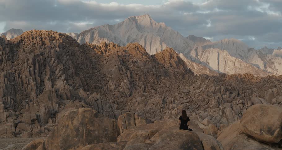 A woman is standing in the canyon
