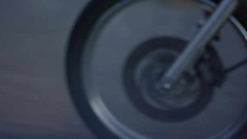 A man is riding his motorcycle