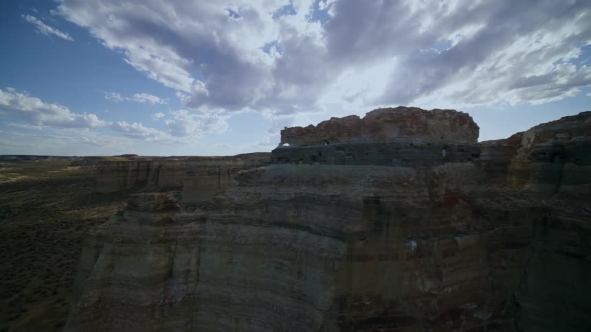 Traversing along a rock wall to reveal a pristine canyon landscape