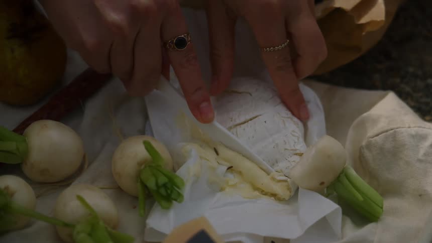 A person cuts a piece of the food