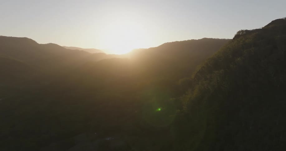 The sun is rising on the mountains