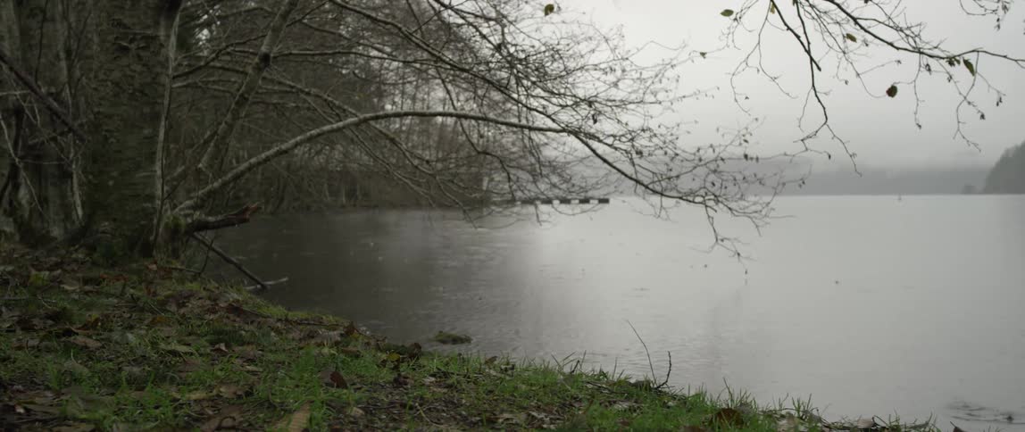Rain drops in a lake on a stormy day