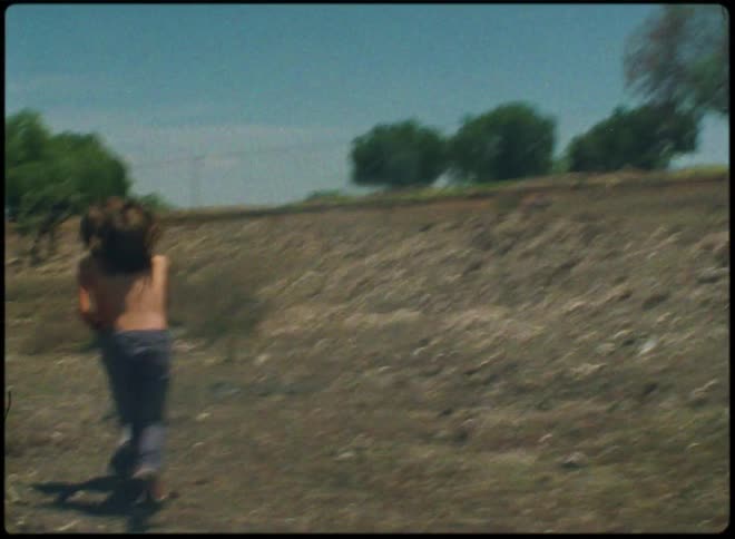 Two teenagers chase each other around