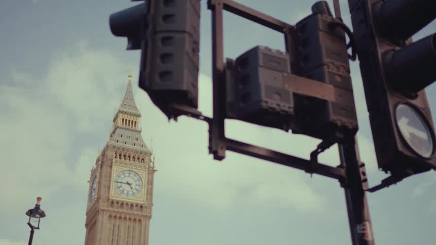 Big Ben in London with traffic lights