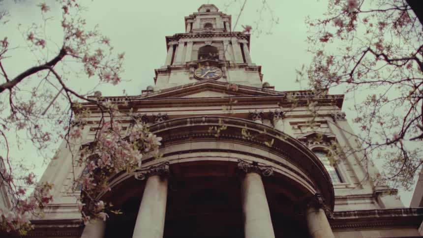 The clock is on the front of the building