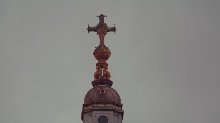 A cross is at the top of the building