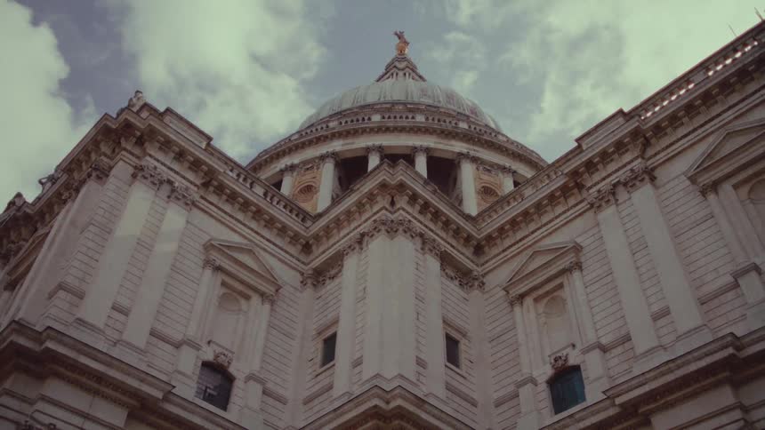 A statue is at the top of the building