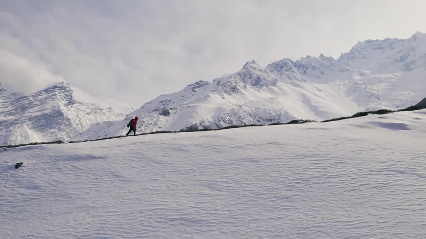 A person is hiking up the mountain