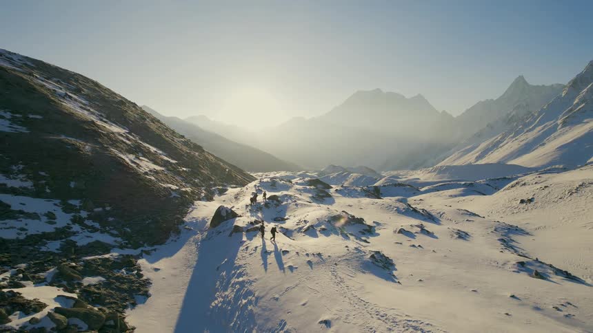 Hikers travel over the mountain range