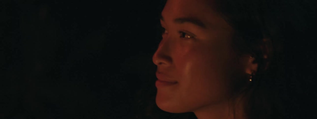Light is flickering on a womans face