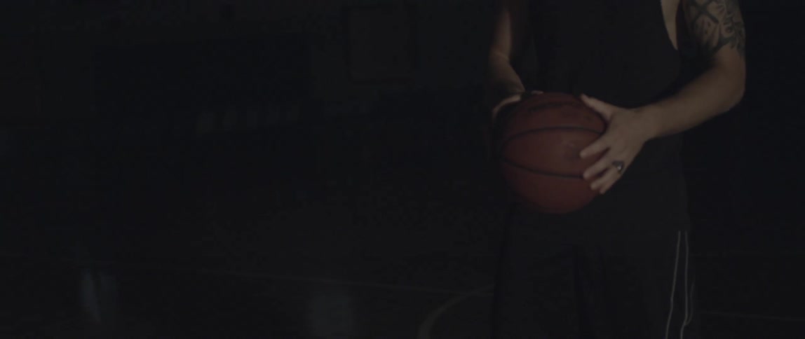 A man dribbles a basketball