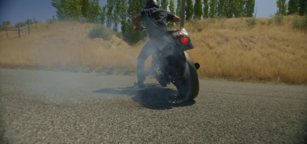 Person peels out on a motorcycle