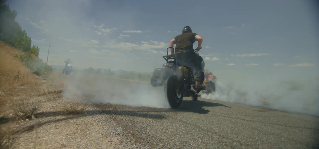 People peel out on their motorcycles