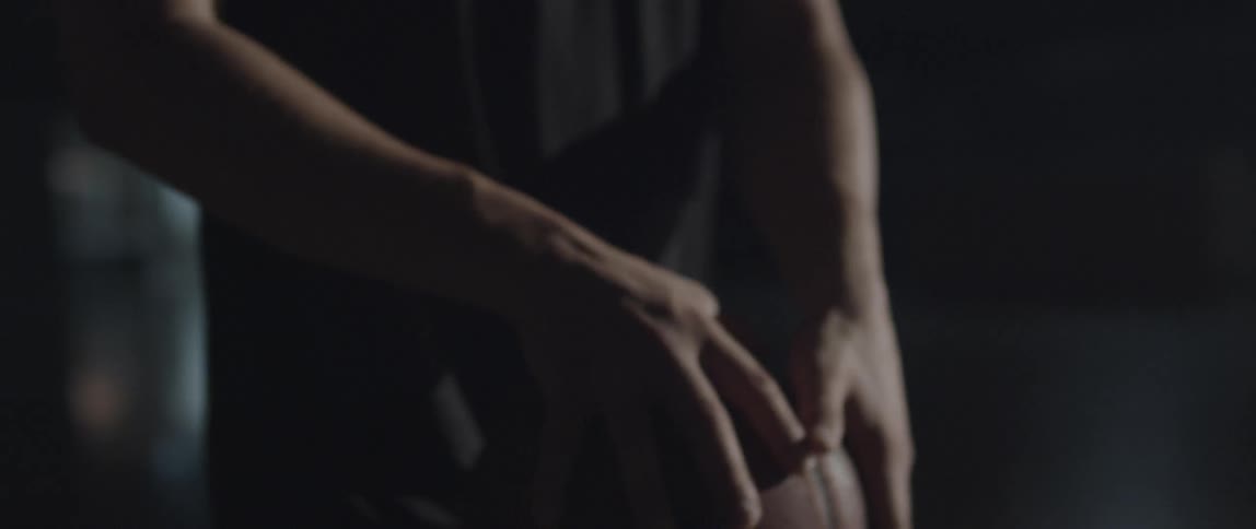 A man shoots a basketball