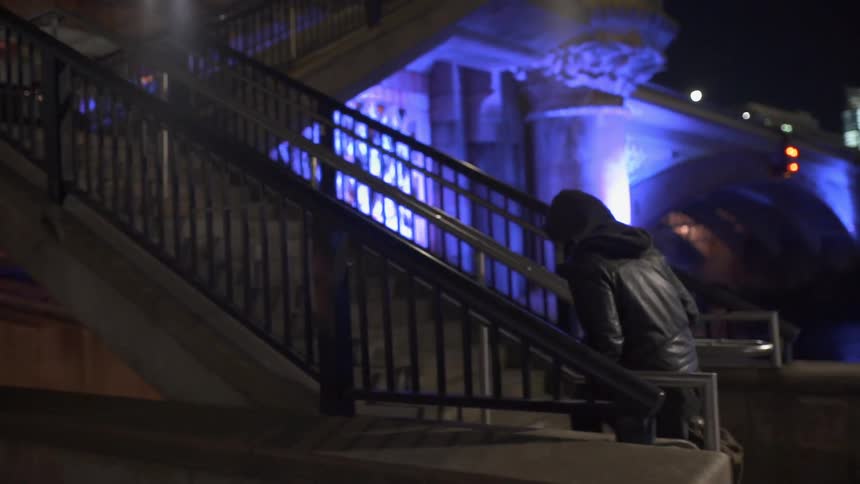 A man is walk and climbs some steps