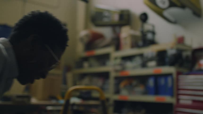 Two people working close to each other on a workshop