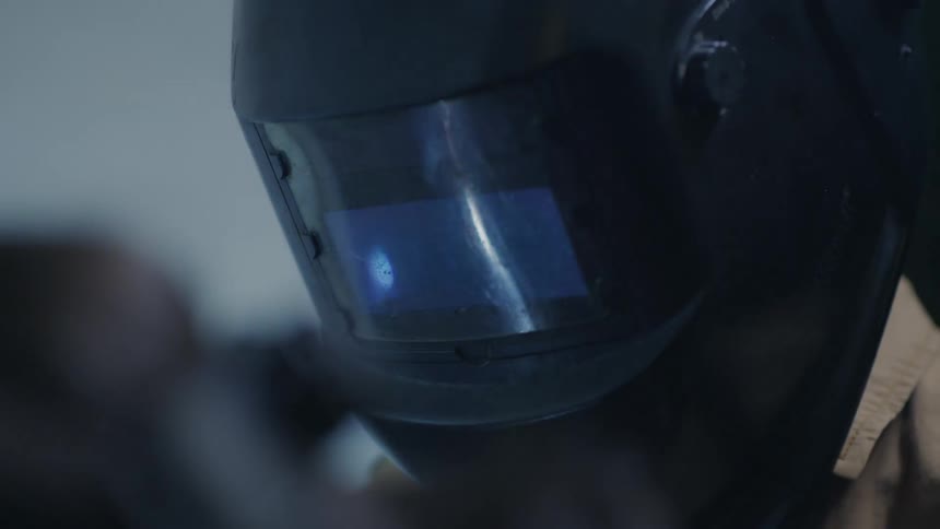 Portrait of a child with welding helmet