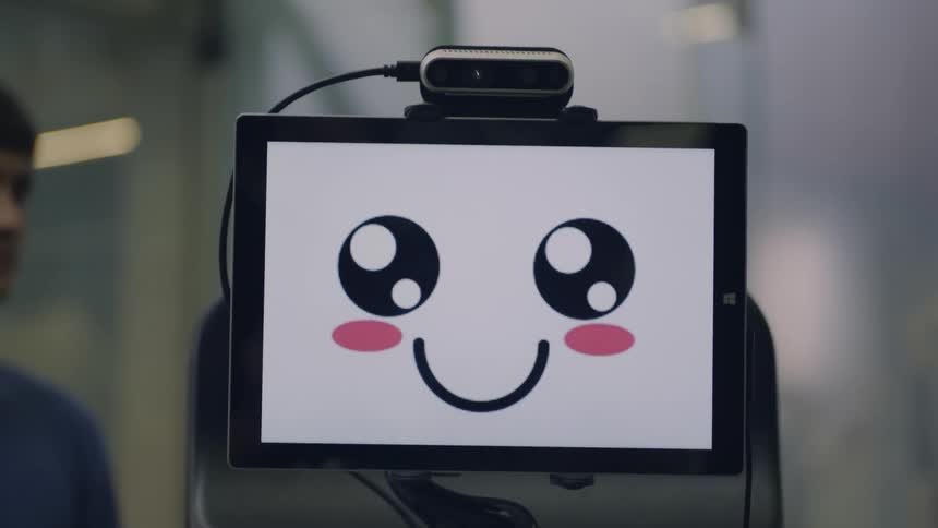 A digital screen with a cute face in the middle on a white background