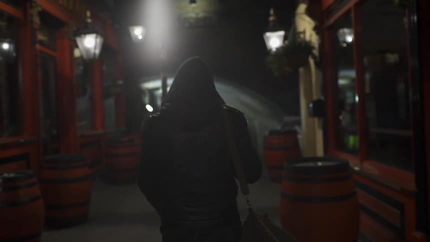 A man is walking carrying a bag