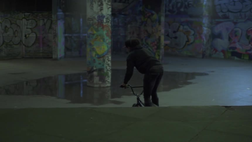 A man is doing tricks on a bike