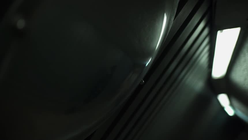 A person is reflected in a concave mirror