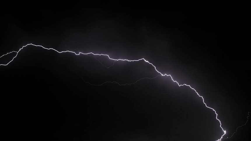 A heavy lightning storm cutting through the night sky